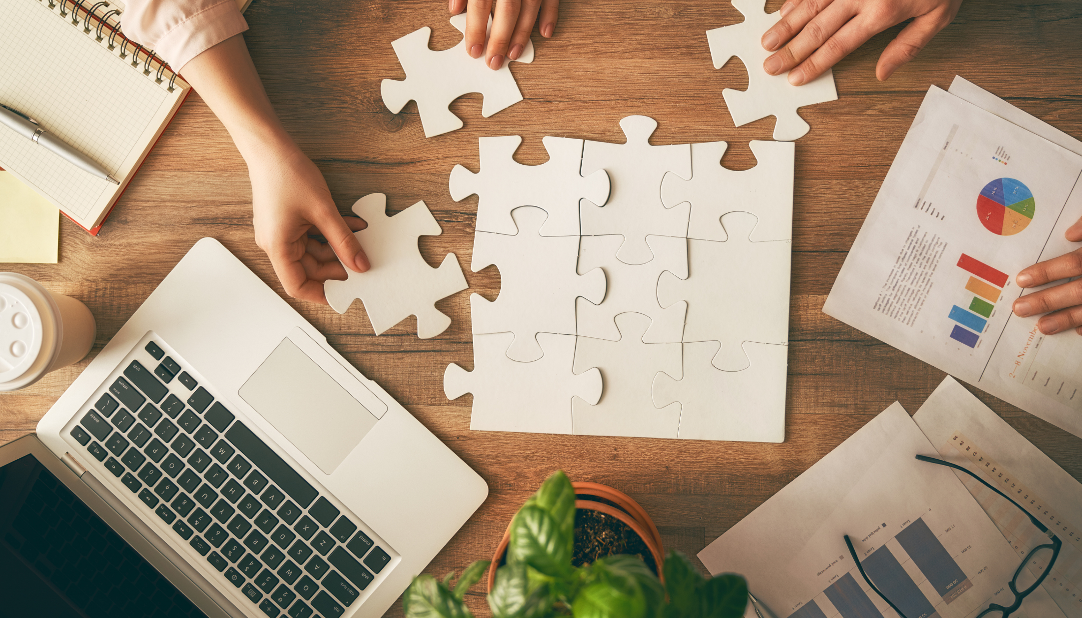 Puzzle, Laptop and Team Creating a Strategy