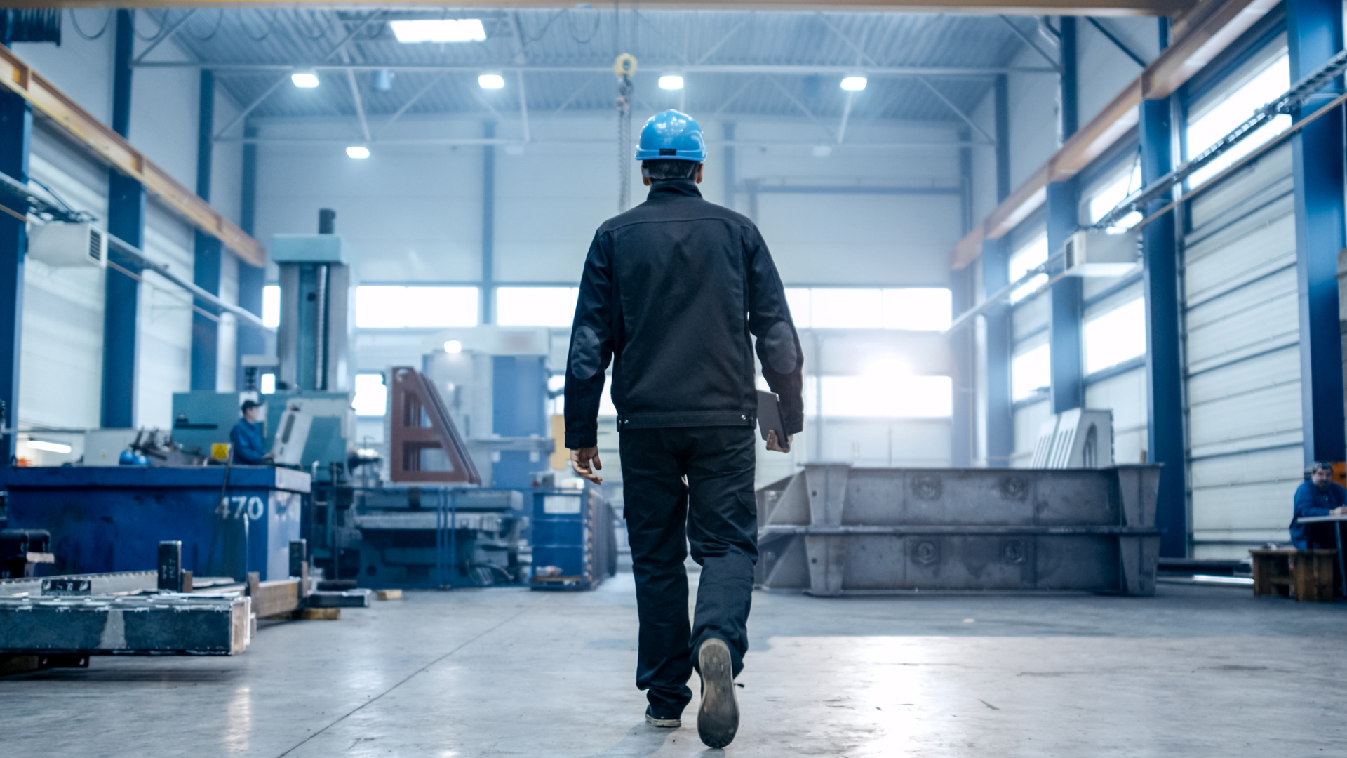 A senior leader walking a factory floor